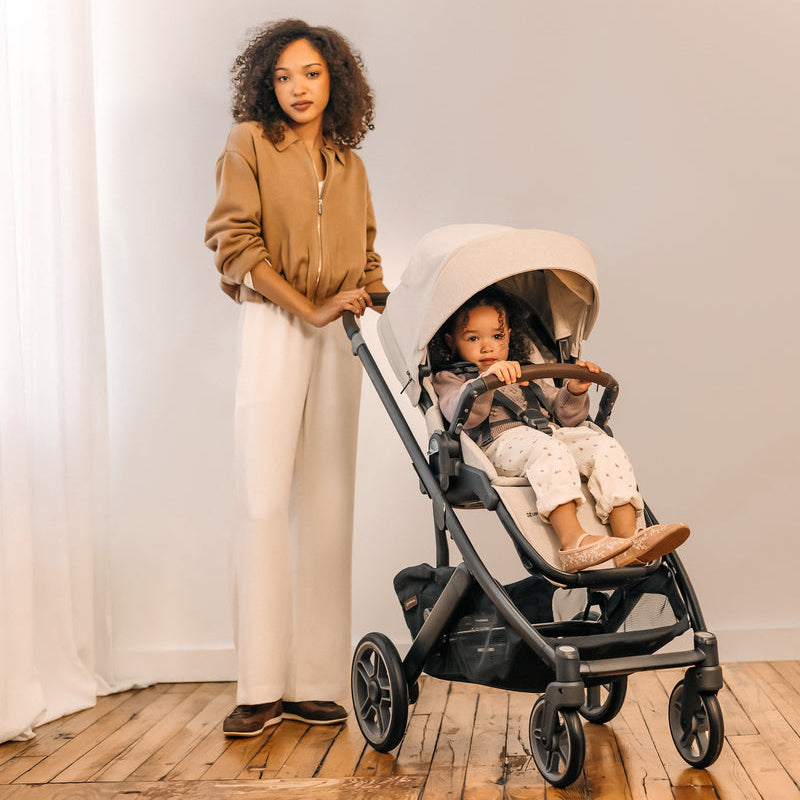 UPPAbaby Cruz V3 Stroller - Ada (Sandstone Melange | Carbon Frame | Chestnut Leather) Lifestyle 1