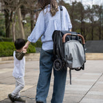 UPPAbaby Minu V3 Stroller - Greyson (Charcoal Melange/Carbon/Saddle Leather) - Lifestyle 4
