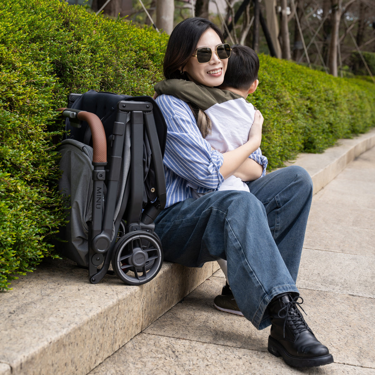 UPPAbaby Minu V3 Stroller - Greyson (Charcoal Melange/Carbon/Saddle Leather) - Lifestyle 2