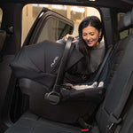 Nuna PIPA Urbn Infant Car Seat - Lifestyle Parent Installing in Vehicle