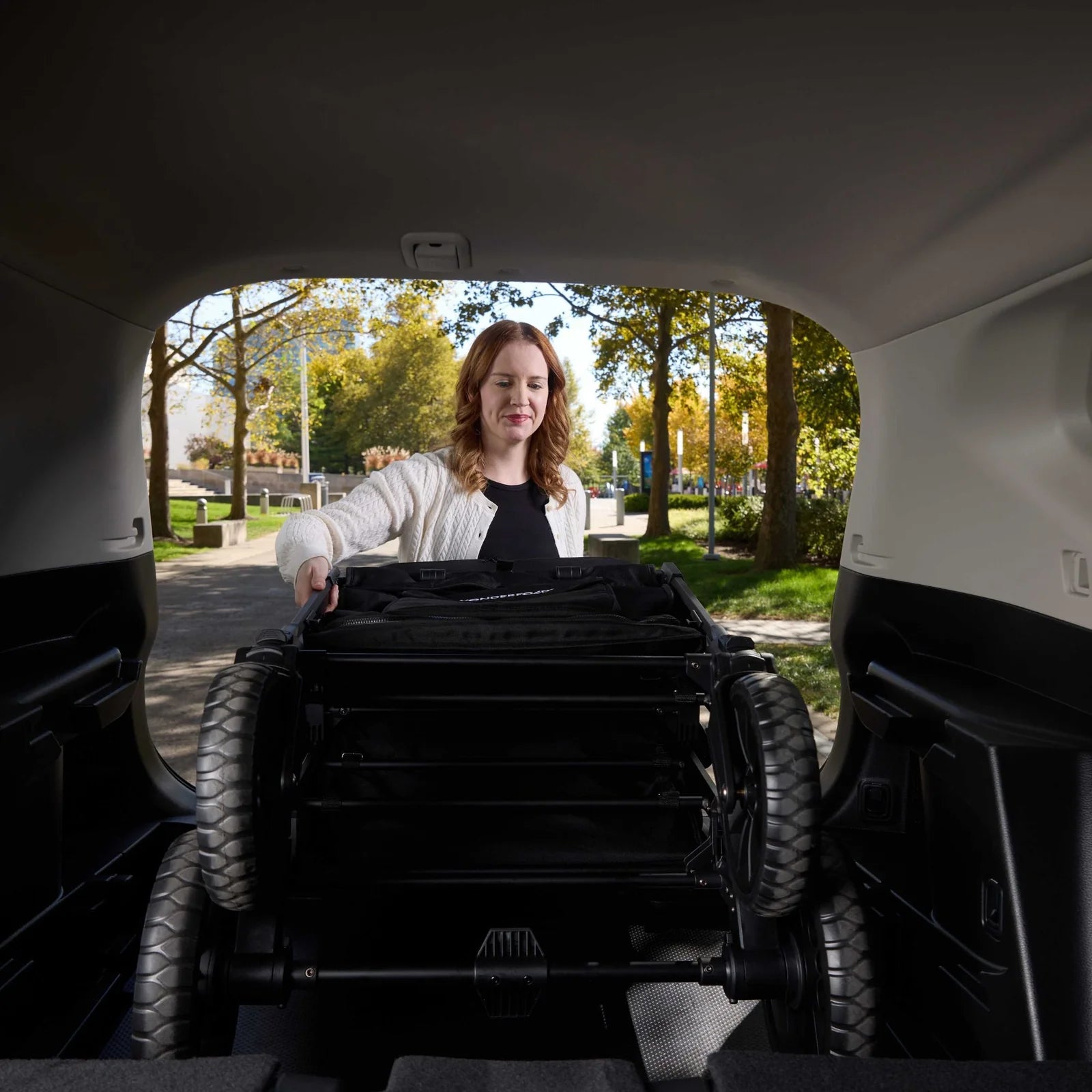 WonderFold W4 Luxe PRO Quad Stroller Wagon - Jet Black Lifestyle 5