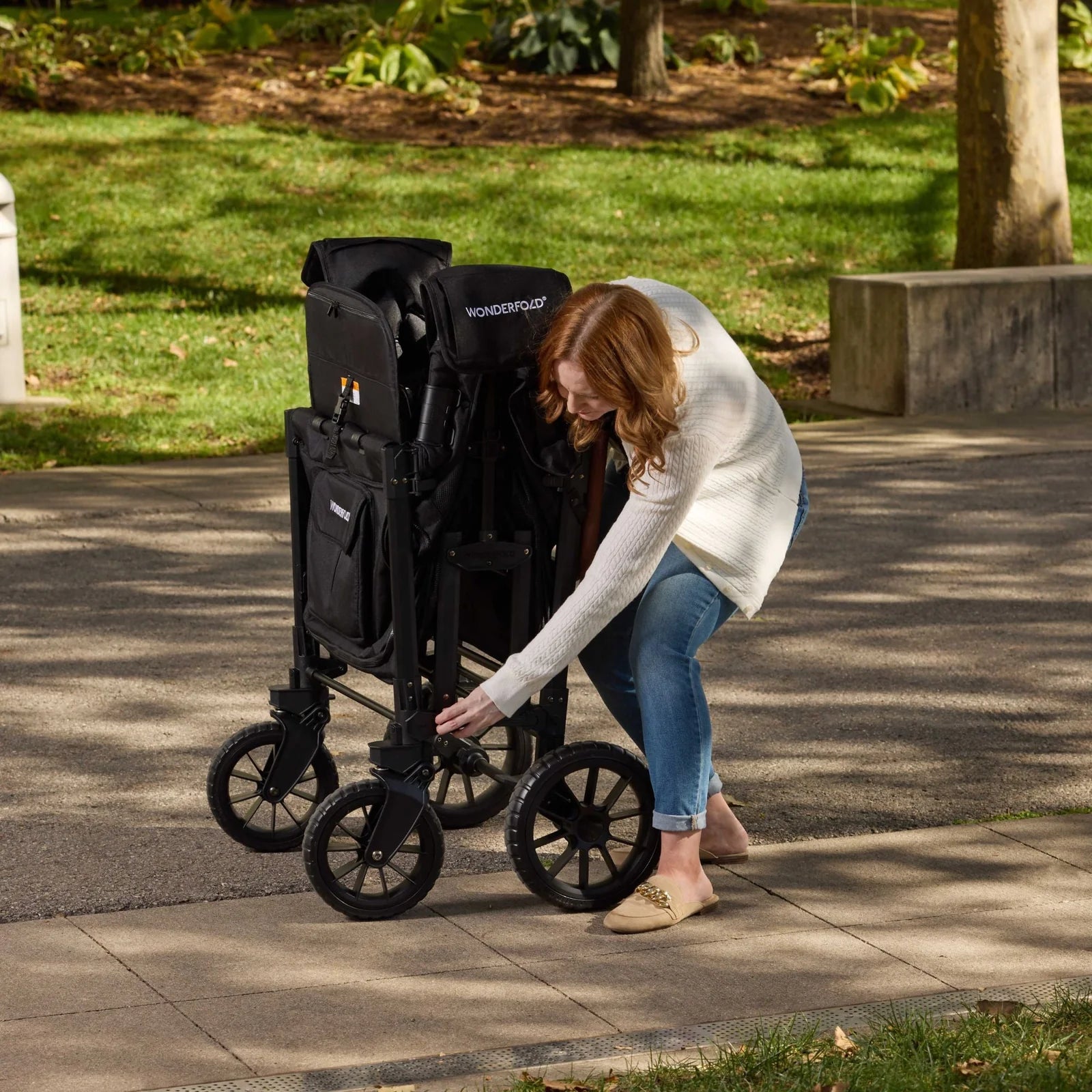 WonderFold W4 Luxe PRO Quad Stroller Wagon - Jet Black Lifestyle 4