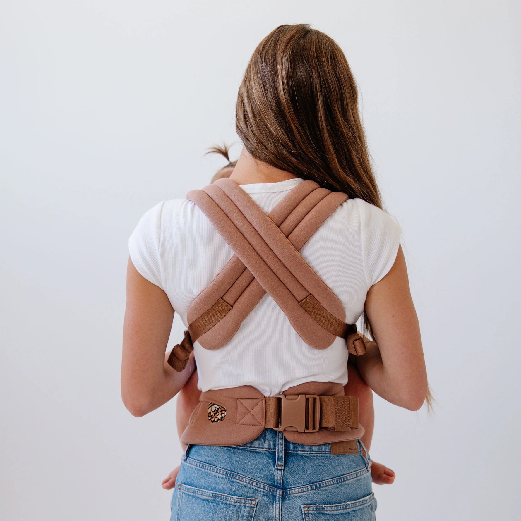 Mabē Monarch Carrier - Mocha Lifestyle 3 Baby Front Facing In Carry Mode with Crisscrossed Straps at Back