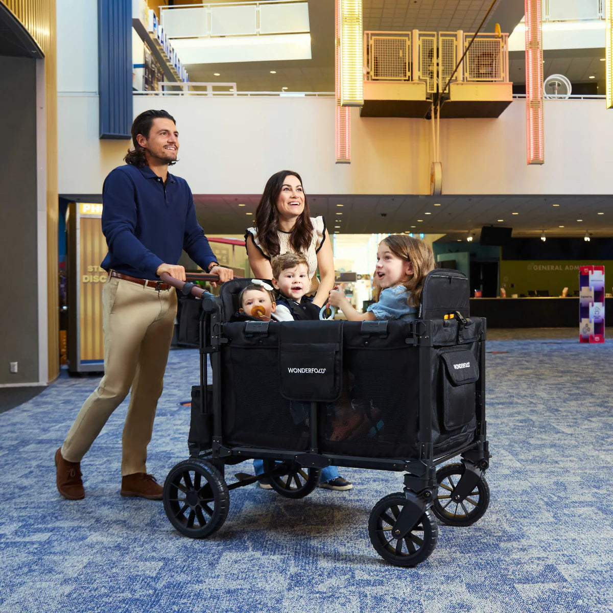 WonderFold W4 Luxe PRO Quad Stroller Wagon - Jet Black Lifestyle 1