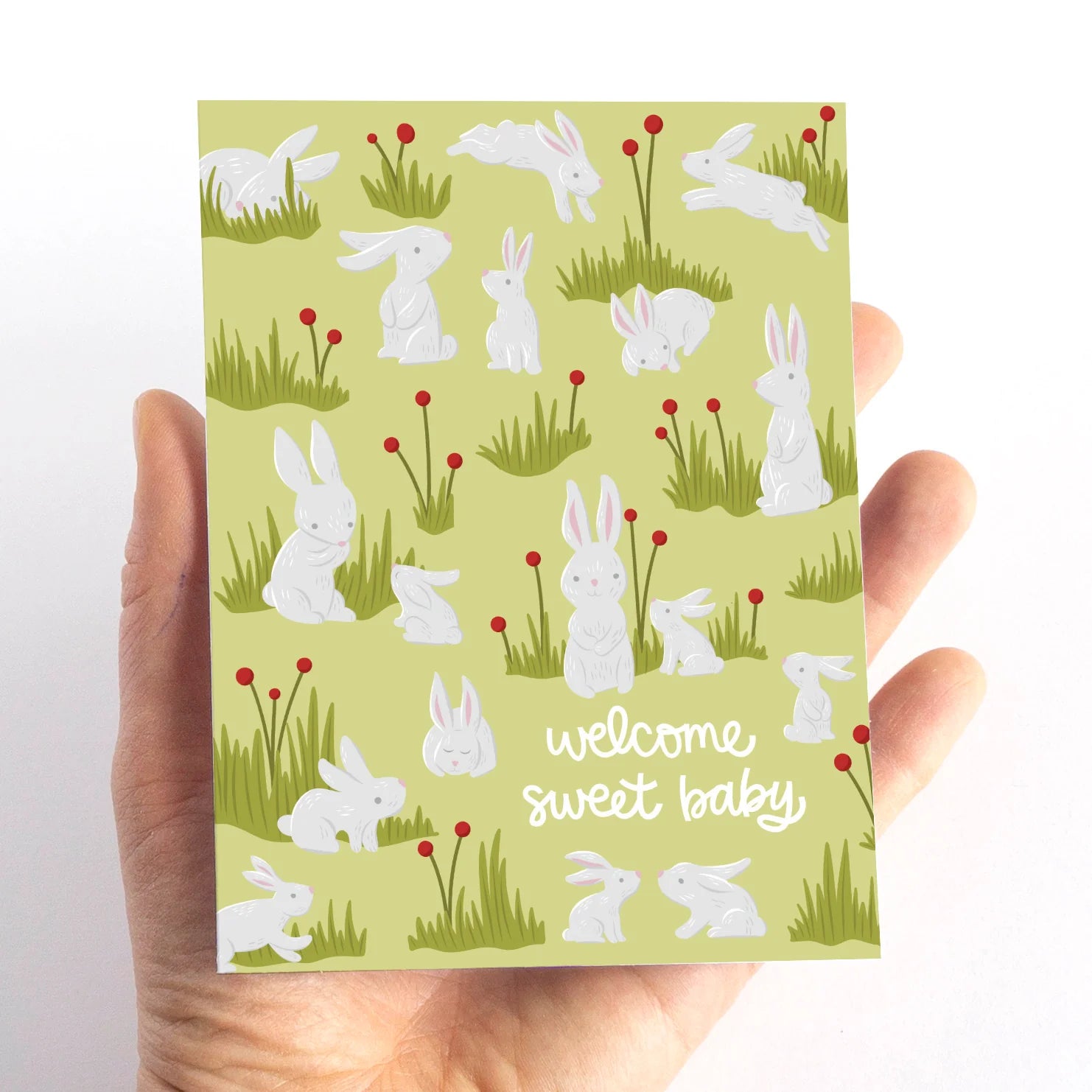 Pedaller Designs Greeting Card - Welcome Sweet Baby Bunny Rabbit Lifestyle 2 In Hand Size