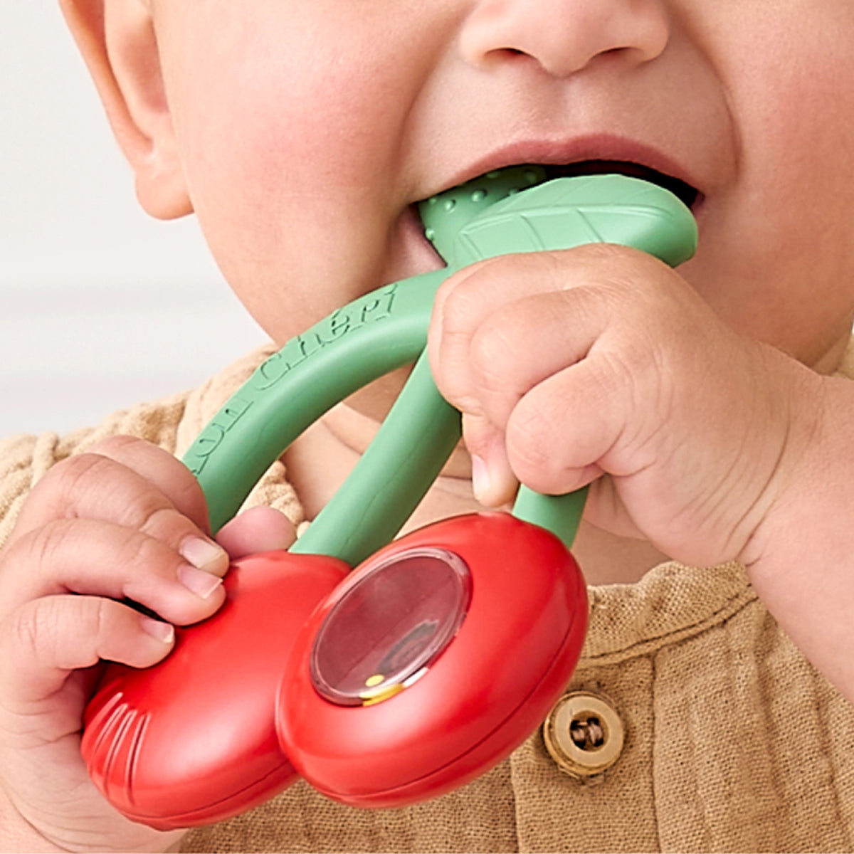 Itzy Ritzy Bitzy Shake™ Silicone Teether with Rattle - Cherries Lifestyle 2