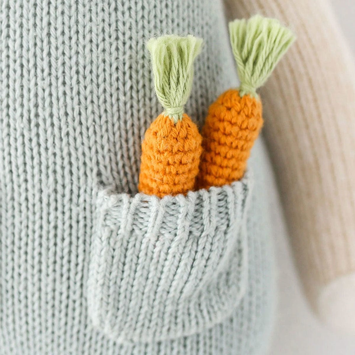 cuddle + kind Hand-Knit Doll - Henry the Bunny Carrot Detail
